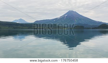 Ilyinsky stratovolcano located in the southern part of Kamchatka Peninsula near Kurile Lake.