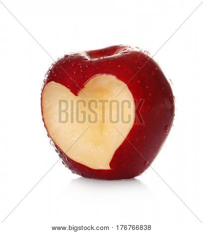 Fresh red apple with heart-shaped cut out  on white background