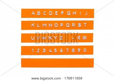 embossed alphabet on orange plastic tape, isolated on white