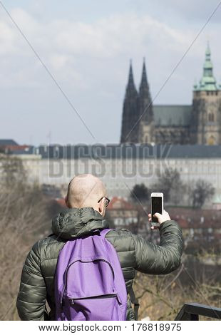 a tourist in Europe taking photo tourist with a back bag travelling around Europe