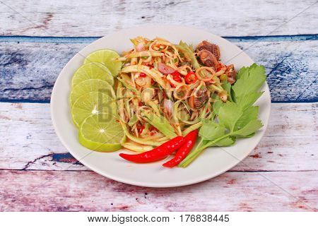 Spicy Minced Mango Salad With Soft-boiled Blood Cockles.