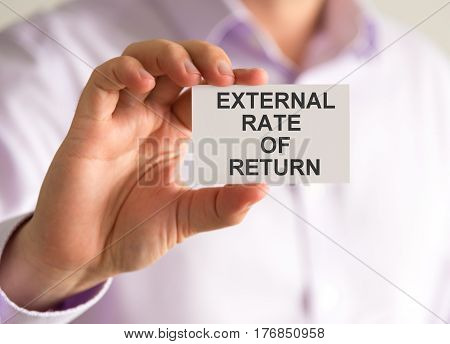 Businessman Holding A Card With External Rate Of Return Message