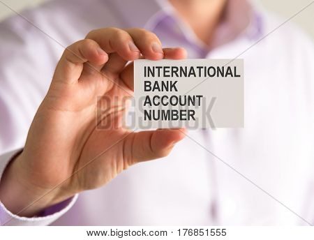 Businessman Holding A Card With Iban International Bank Account Number Message