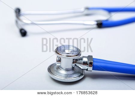 RX prescription, Red heart, asorted pils and a stethoscope on white background.