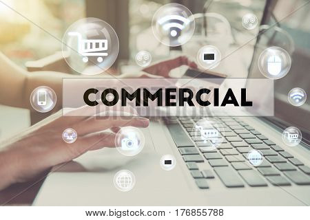 business hand holding credit card with computer and word Commercial. can used for cover page presentation and web banner. e-commerce internet technology concept.