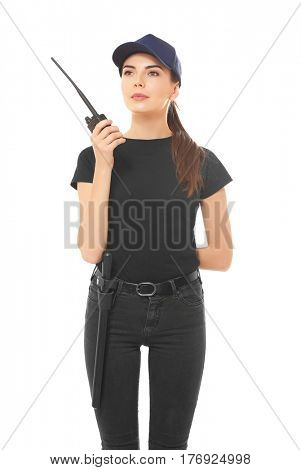 Beautiful young woman in security uniform on white background