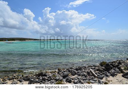 Clear crystal waters of Baby Beach in Aruba perfect cove for snorkeling.