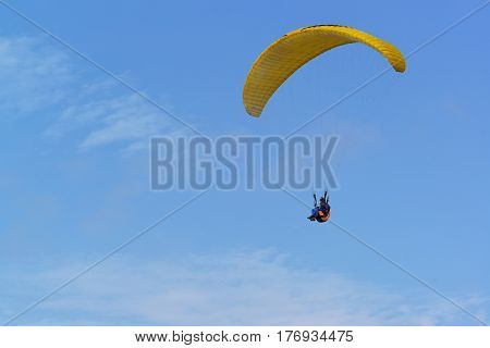Anapa district Krasnodar Krai Russia - August 15.2015: Paragliding - non-powered manned aircraft with soft wing which is inflated via the air intakes RAM air on background blue sky