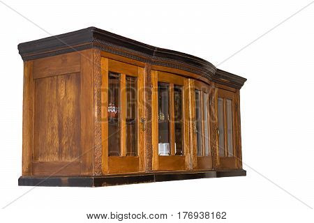 Old brown wooden kitchen cabinet suspended. Side view. With glass inserts in the door