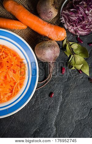 Beets, Carrots And Cabbage During Cooking. Composition On A Dark Background.