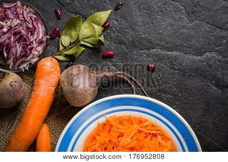 Beets, Carrots And Cabbage During Cooking. Composition On A Dark Background.