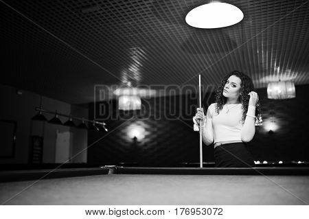 Young Curly Girl Posed Near Billiard Table. Sexy Model At Black Mini Mini Skirt Play Russian Snooker