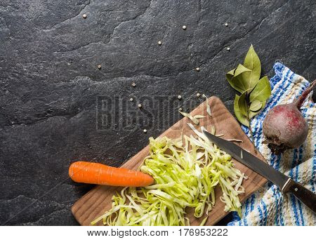 Beets, Carrots And Cabbage During Cooking. Composition On A Dark Background.