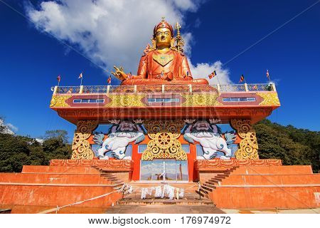 Samdruptse statue a huge buddhist memorial statue in Sikkim blue cloudy sky in background.