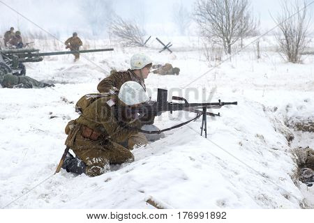 SAINT PETERSBURG, RUSSIA - JANUARY 15, 2017: the Soviet machine gunners with a machine gun in battle. A fragment of the military-historical festival for the release of the Krasnoe Selo. Operation 