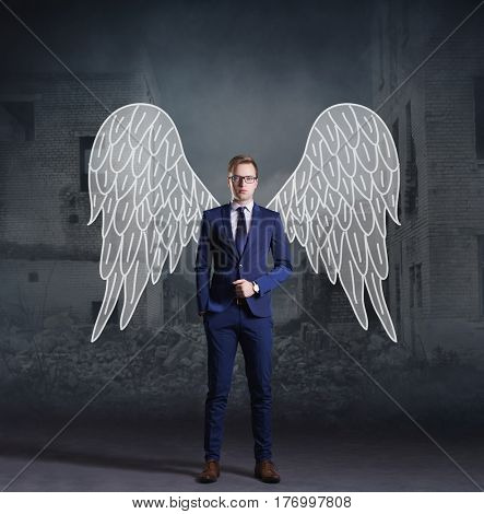 Business angel standing on apocalyptic background. Crisis, default, setback concept.