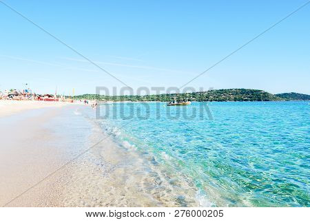 Beautiful And Clear White Sand Beach With Background Mediterraniean Blue Sea And Soft Light Blue Sky