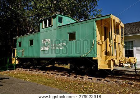 Pekin, North Dakota, September 1, 29018: The  Old Peeling Bn Logo On The Side Of The Green Caboose W