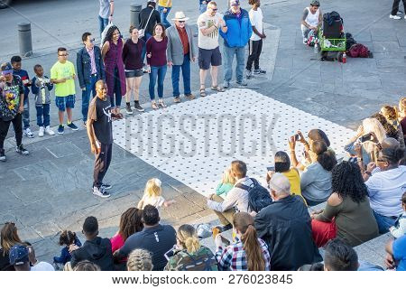 New Orleans, Usa - Dec 4, 2017: A Street Performer Doing His Act Entertaining A Public Audience Alon