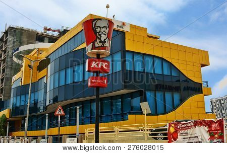 Modern Yellow-blue Building And A Sign Of Kfc Restaurant. Fast Food Restaurant Chain In West Africa.