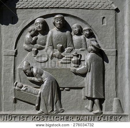 ZURICH, SWITZERLAND - JUNE 23, 2018: Zwingli and his family, relief on the door of the Grossmunster (