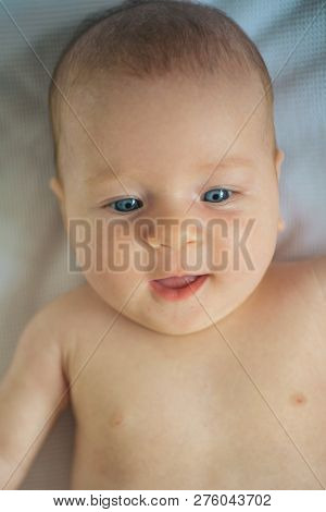 Happy Newborn Girl Or Boy. Health Care For Happy Baby. Birthrate And Fertility. The Birthrate Goes U