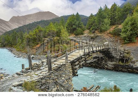 Wooden Footbridge On The Annapurna Circuit Near Dhiktur Pokhari, Nepal