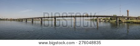 Panoramic View Of Large Concrete Road Bridge Spanning Large Wide Nile River In Egypt At Kom Ombo