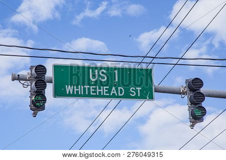 Beginning Of Us 1 Highway In Key West At Whitehead Street Under Blue Sky With Traffic Light