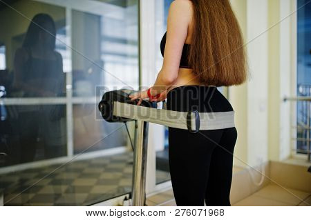 Young Sport Girl Workout In Gym. Fitness Woman Doing Exercises. Sexy Ass At Anticellulite Massager S