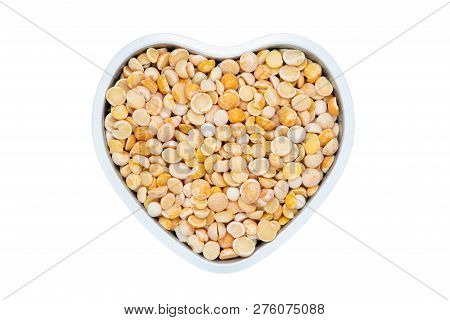 Yellow Split Dried Peas, Heart-shaped, Isolated, Close Up, Macro, Top View. Healthiest Nutritious Fo