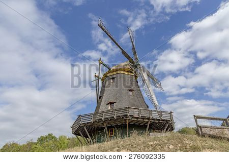 Old Wooden Windmill Under Clrear Blue Sky