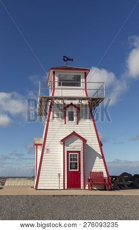 Arisaig Lighthouse In Nova Scotia Under Blue Sky