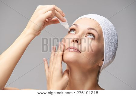 Woman Using Eye Drops. Medicine Treatment. Eyecare Human Problem. Ophtalmology Dropper