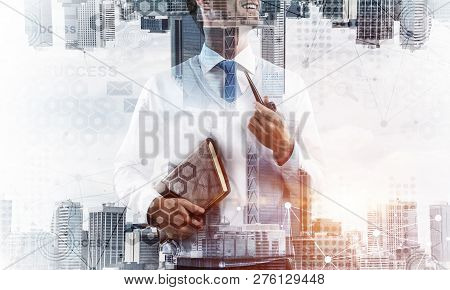 Confident And Young Businessman In Smart-casual Wear Smoking Pipe And Modern Cityscape With Business