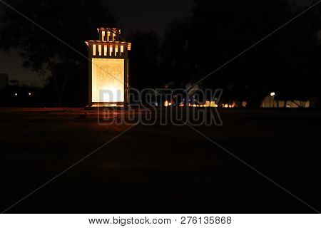 A Lantern On A Wooden Surface Illuminating The Darkness Of The Night
