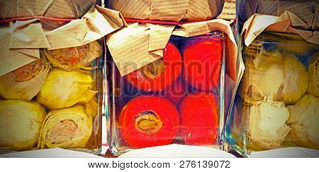 Red Peppers With Tuna Inside And Artichokes In Oil For Sale In The Italian Shop Of Typical Gastronom