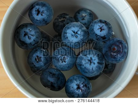 Blueberries In A сup Of Water Close-up