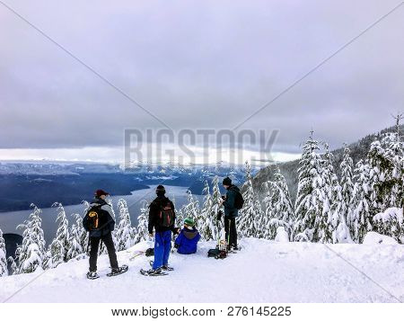 Cypress Mountain, British Columbia, Canada - December 27th, 2018: A Group Of Snowshoers Admiring The