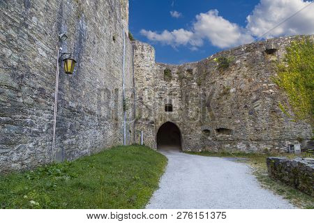 Ruins Of Castle Koenigstein ( Konigstein ) . Fortress Wall Against The Blue Cloudy Sky, Entrance To 