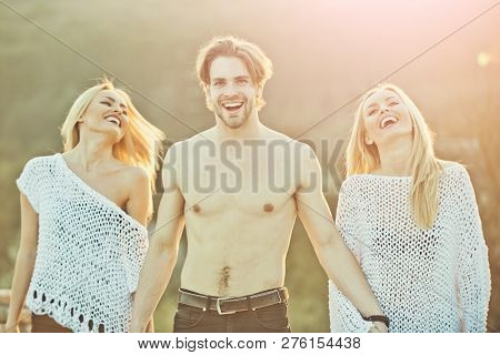 Love And Romance. Girl And Women With Boyfriend Outdoor. Blonde And Guy With Athletic Chest. Beauty 