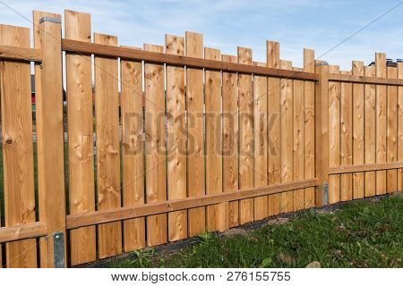 Stylish Privacy Shield Made Of Wooden Boards Also Serves As Noise Protection