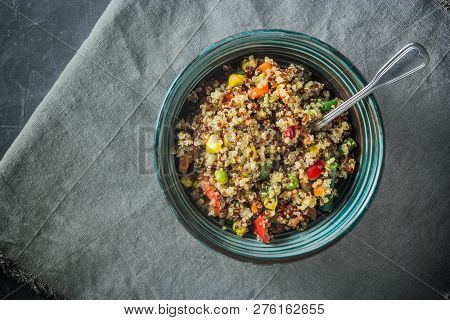 Quinoa Salad Bowl With Various Vegetables: Green Beans, Carrot, Corn, Bell Pepper, Peas On A Table W
