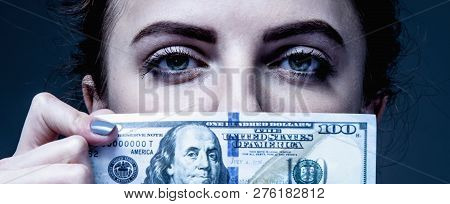 Woman Covering Her Mouth With A Dollar Banknote As Symbol Of Bribery, Cheating, Financia And Politic