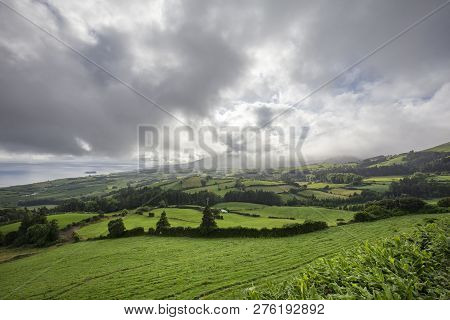 Clouds Putting On A Show Above The Beautiful Countryside On Sao Miguel Island In The Azores.