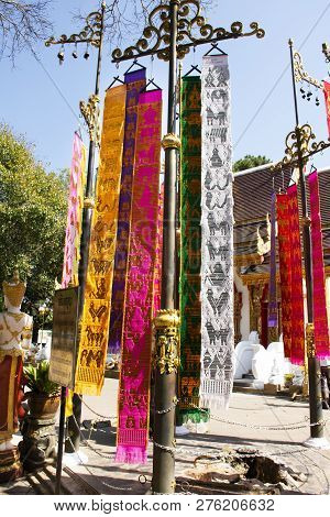 Thai People And Foreign Travelers Hanging Holy Flags Or Colorful Tung Flag Of Lanna Or Northern Of T