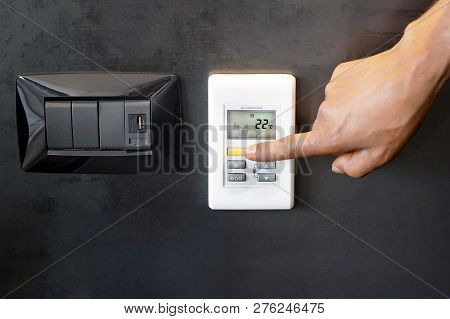 Male Hand Try To Turn On The New Air Condition In Room, In The Hotel Room. Caucasian Man Hands On Th