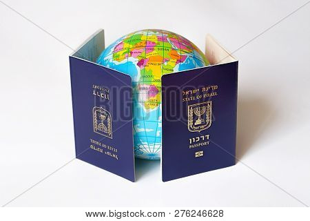 Blue Israeli Biometric And Non Biometric Passport Isolated On White Background. A Map Or Globe Of Pl