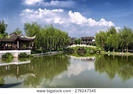 A Chinese Gazebo On A Small Lake Within The Luzhi Ancient Town Scenic Area On A Sunny Day In Wuzhong