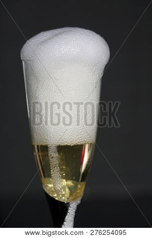 Champagne. Pouring Champagne into a glass. Glass of Champagne.

